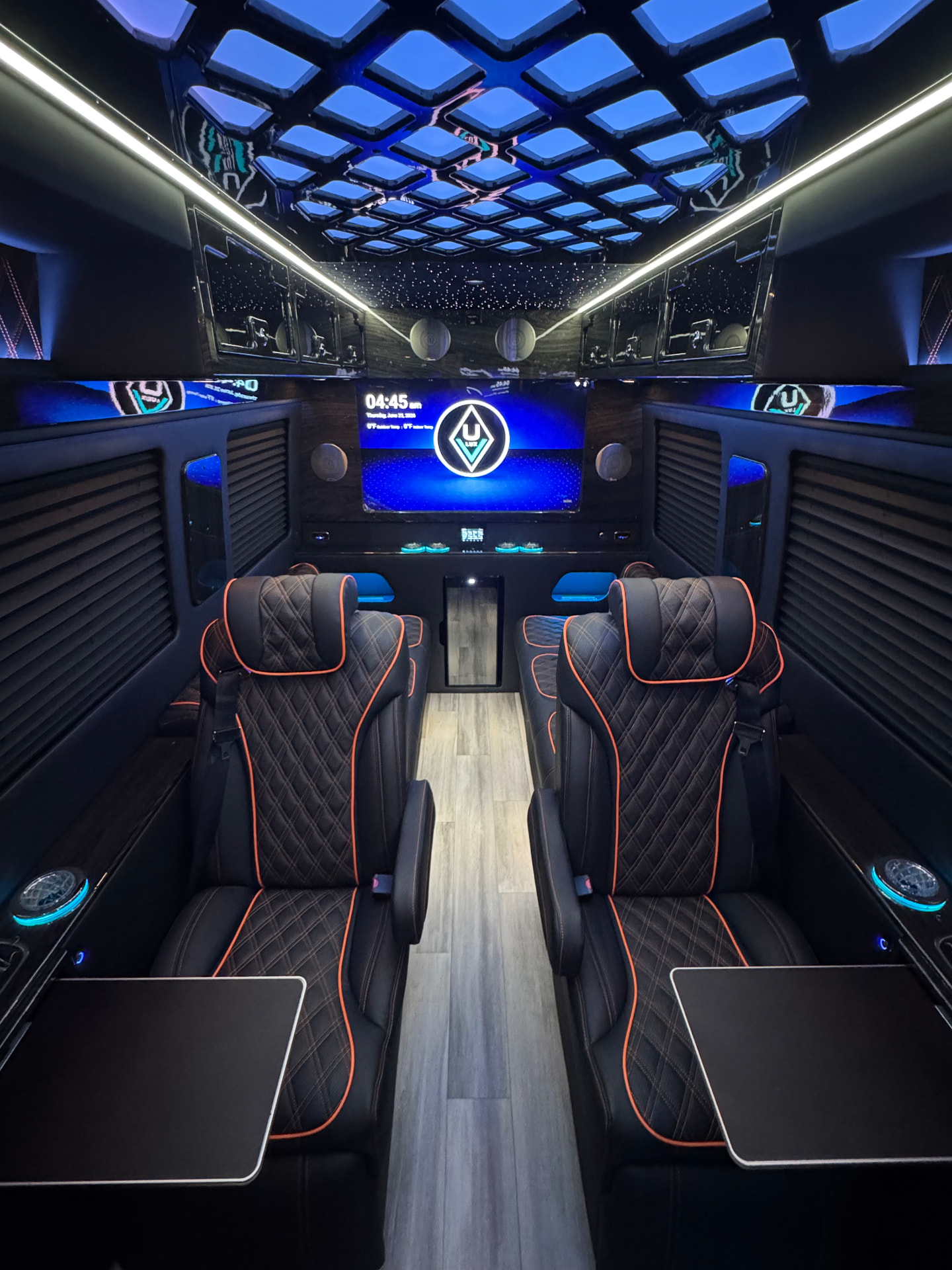 Executive cabin interior with diamond-stitched seating and ambient lighting